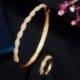 Fém színe: sárga arany - CWWZircons Twist Lines Cubic Zirconia Dubai Rose Gold színű nyitott mandzsetta menyasszonyi