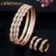 Fém színe: sárga arany - CWWZircons Twist Lines Cubic Zirconia Dubai Rose Gold színű nyitott mandzsetta menyasszonyi